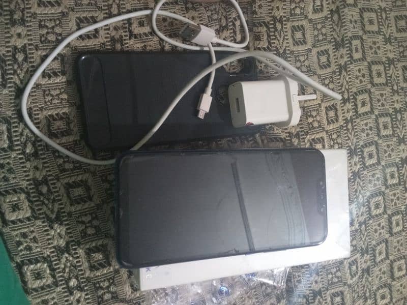 mob with charger and box and data cable 0