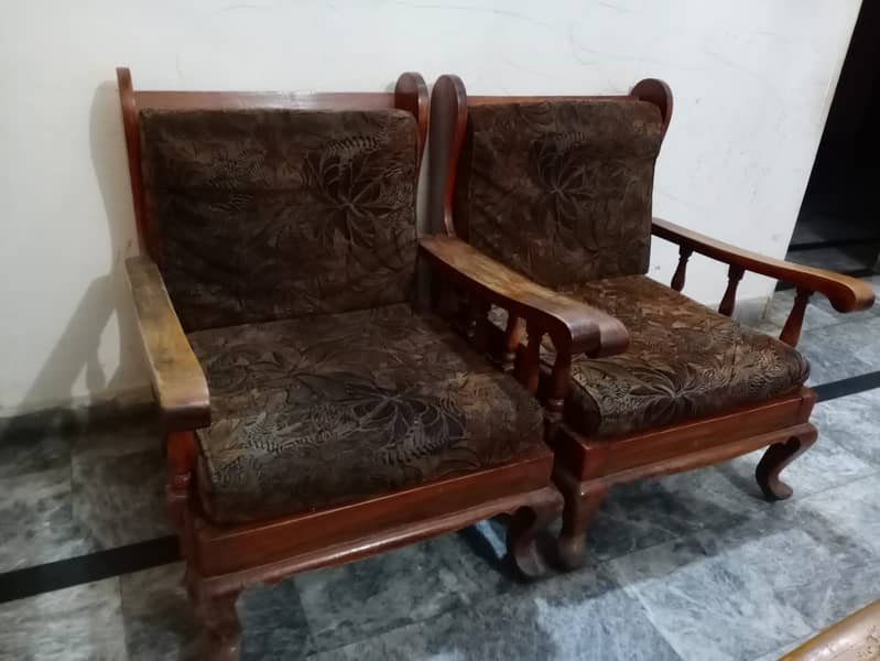 5 seater wooden sofa set (30,000)+ 3 tables (10,000) = 40,000 2