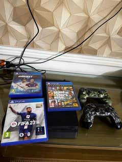 ps4 slim with 2 controllers + GTA 5 + RDR 2 + Fifa22 + cricket 22