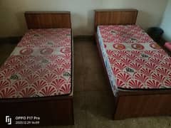 Two single beds pair with mattress.