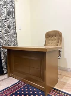 Light brown writing table and office chair