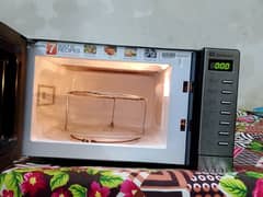 Dawlance microwave oven 2 in 1 with grill stand clean condition