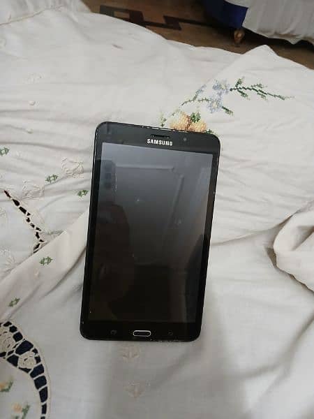 Samsung tablet in Black color along with a cover 0