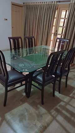 6 seater beautiful glass top dinning table and chairs