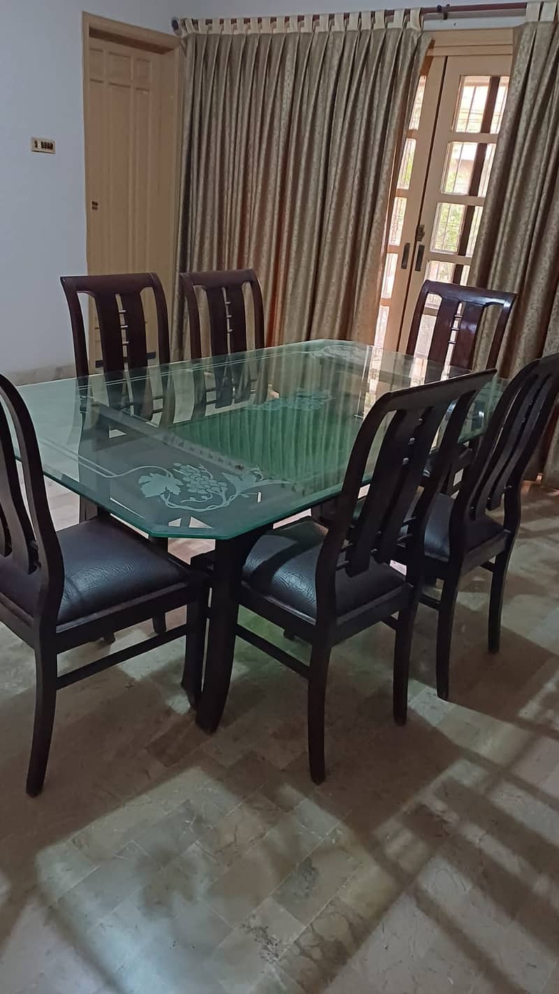 6 seater beautiful glass top dinning table and chairs 0