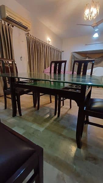 6 seater beautiful glass top dinning table and chairs 3