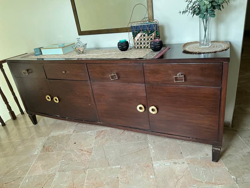 a huge console with spacious cupboards and drawers for crockery 0