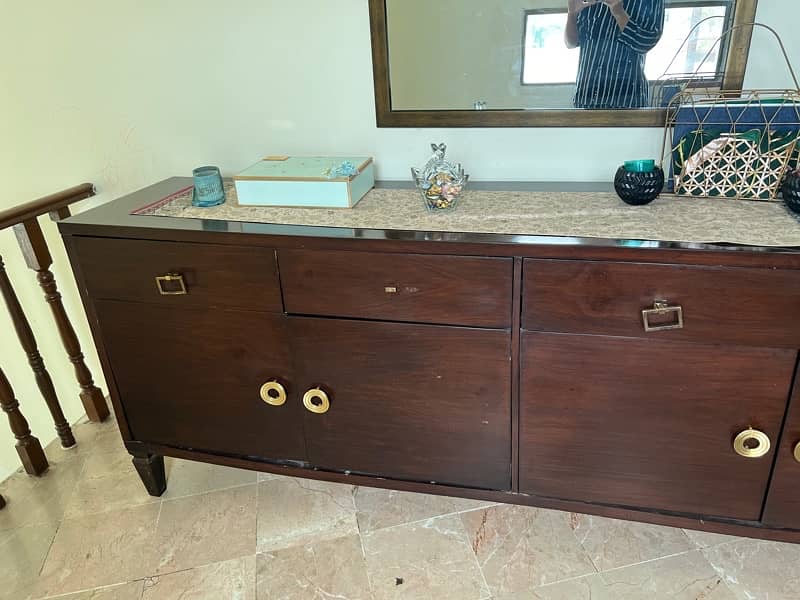 a huge console with spacious cupboards and drawers for crockery 1