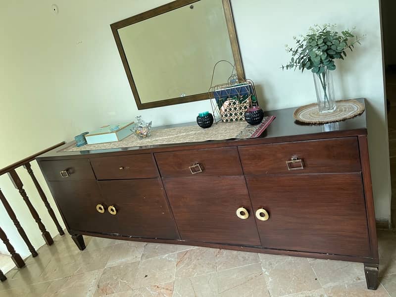 a huge console with spacious cupboards and drawers for crockery 2