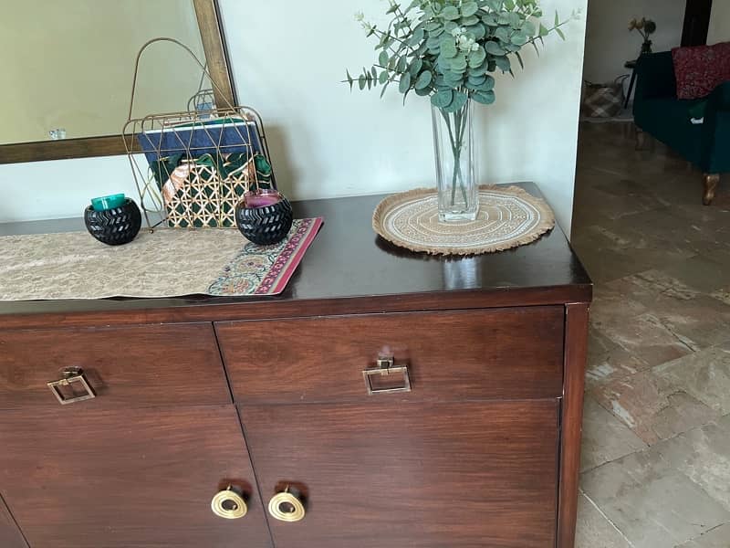 a huge console with spacious cupboards and drawers for crockery 3