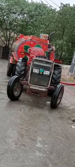 Tractor with water tanker