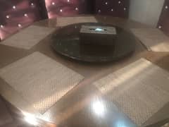 Brown dining table set with matching table mats and a rotating tray 0