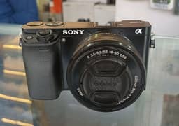 Sony a6000 Mirrorless DSLR camera with original charger strap battery