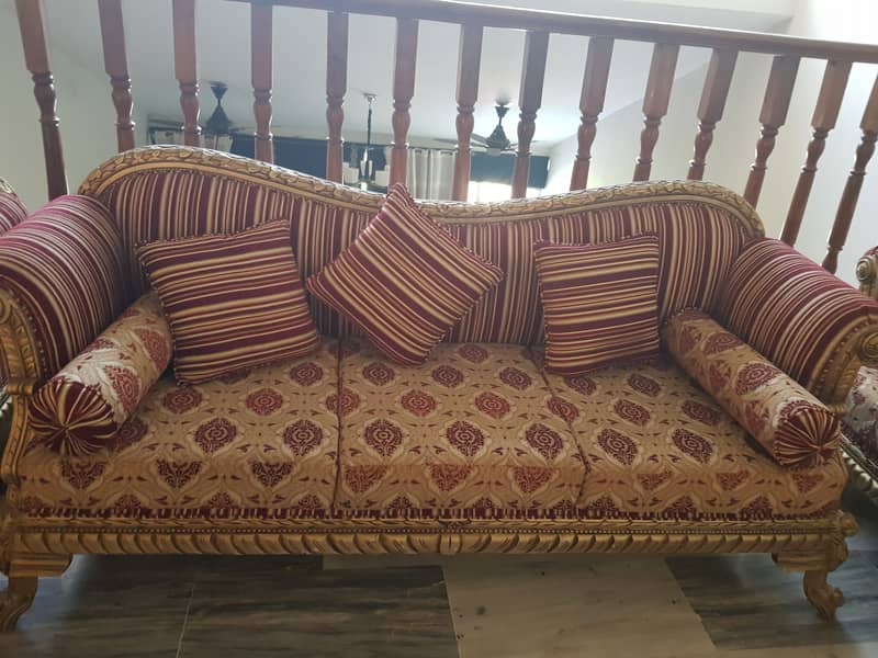 7 Seater Sofa made with sheesham wood, molty foam and mettalic leafin 1