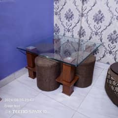 glass table with 4 stools