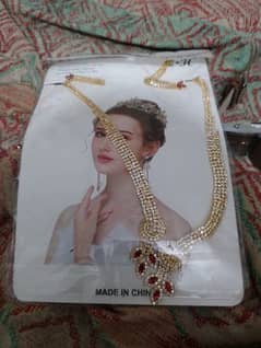 gold necklace with red rubys