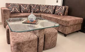 L-Shaped sofa with centre table and stools