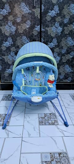 Kid blue carry cot battery operated