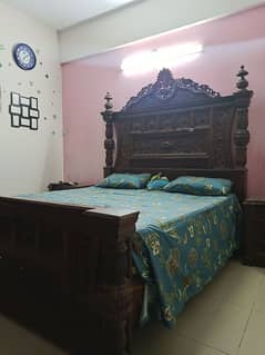 king size bed, with side tables and dressing table