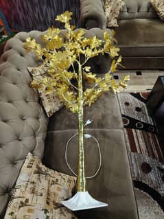 A lovely light tree in yellow colour for sale in brand new condition