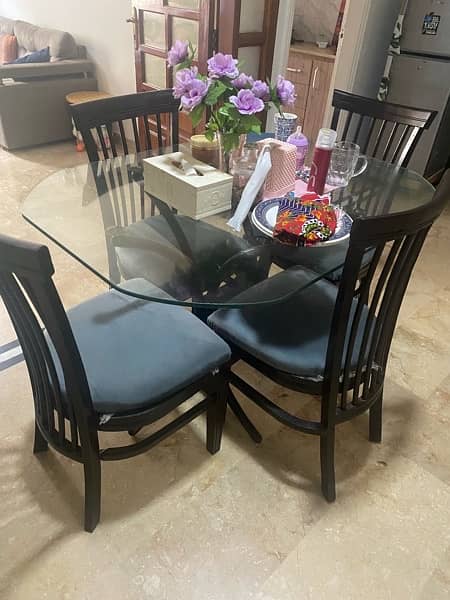 Iron Rod dining Table with glass and wooden chairs 1