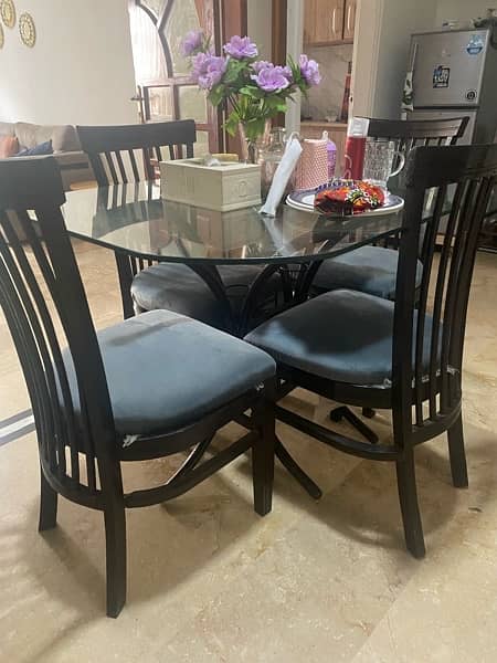 Iron Rod dining Table with glass and wooden chairs 2