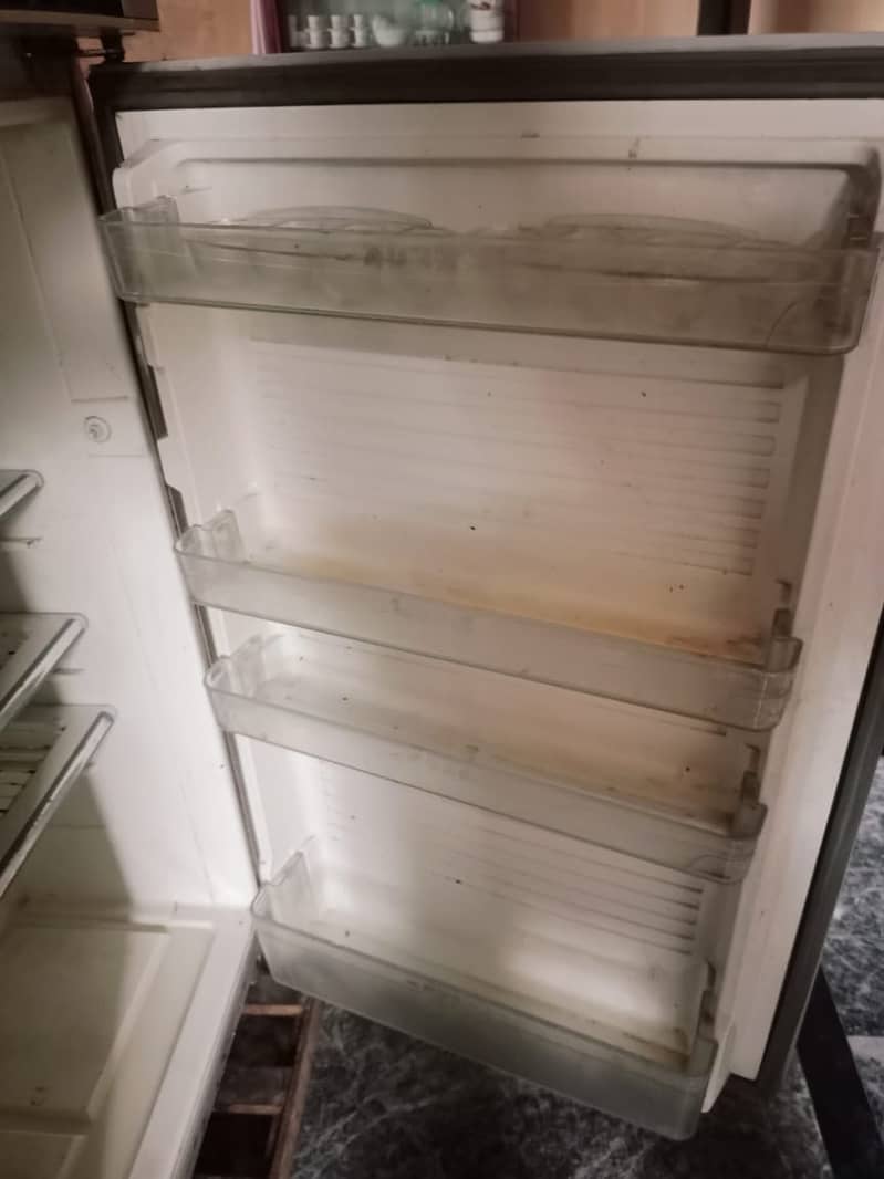 DAWLANCE REFRIGERATOR (FREZZER BASE DAMAGE BY SHARP TOOL & GASE LEEKED 3