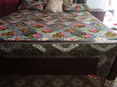 wooden bed in good condition