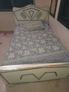 wooden single bed