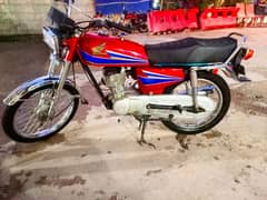 Honda 125. Islamabad number.