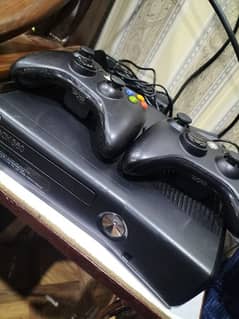 xbox 360 with original 2 wireless controllers 2 batteries 2 chargers.