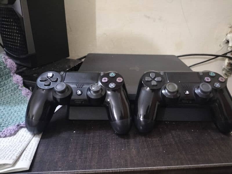 Ps4 slim 1 Tb storage  with 2 original controllers and 4 games 1