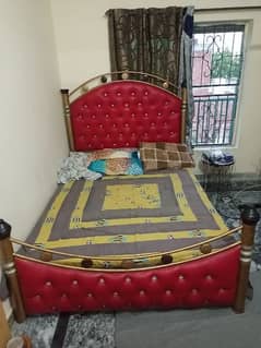 Steel Bed with golden color with mattress.