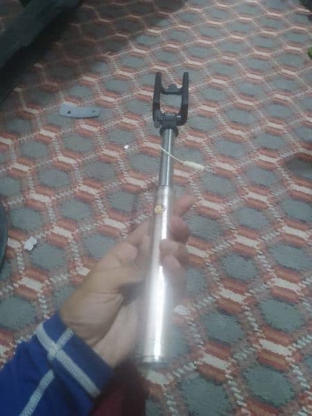 holder stand for torism with camera button 0