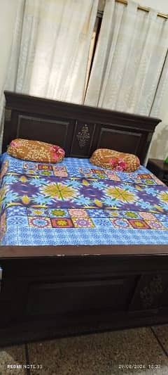 king size bed with two side tables dressing table and spring mattress