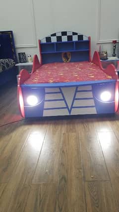 wooden kids car bed with  mattress in used just for 15000 in lahore