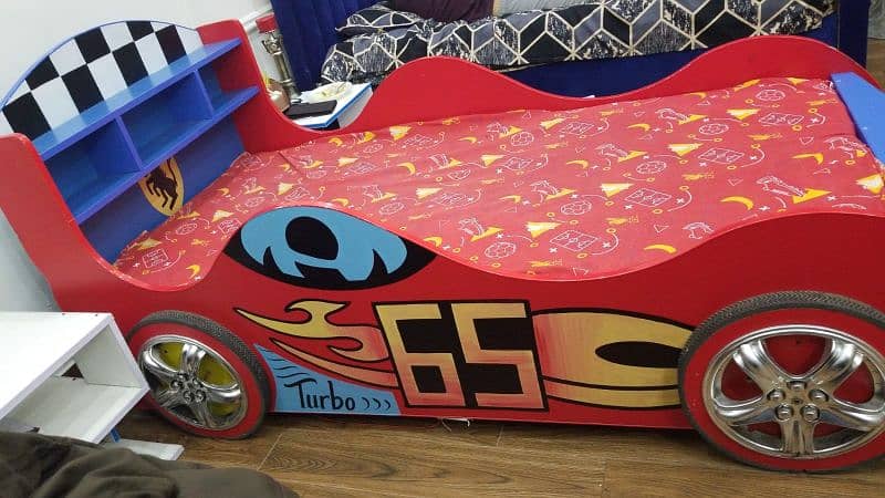 wooden kids car bed with  mattress in used just for 15000 in lahore 1