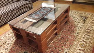 Centre table , with thick glass top , wooden base