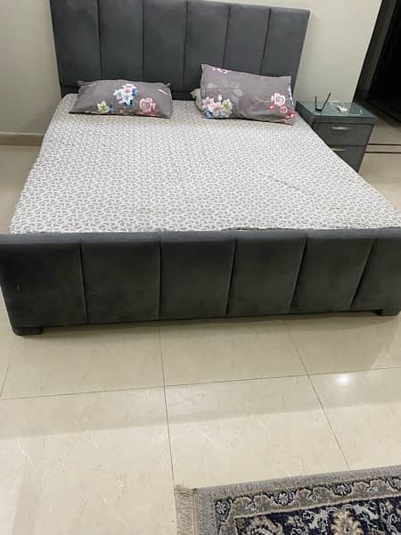 good condition bed  in grey colour with two side tables 0