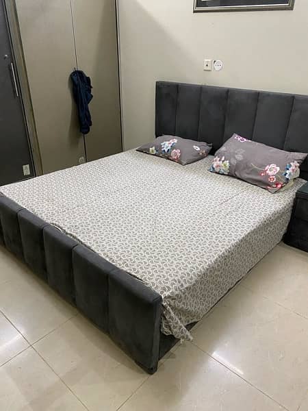 good condition bed  in grey colour with two side tables 1