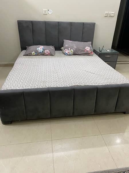 good condition bed  in grey colour with two side tables 2