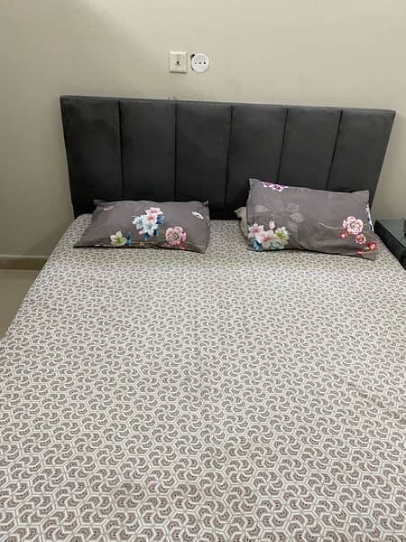 good condition bed  in grey colour with two side tables 3