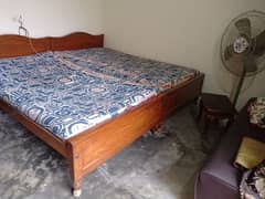 Two Wooden Single Beds