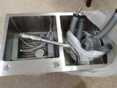 double kitchen sink and mixer and basket