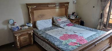 Wooden king size bed with 2 side tables.