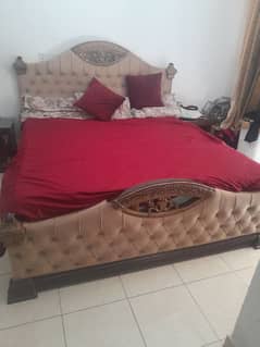 bed with side table and dressing table