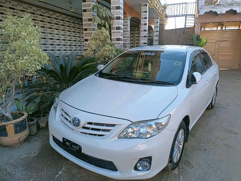 Toyota Corolla GLI 1.6 model 2013 Islamabad Registration white colour. 1