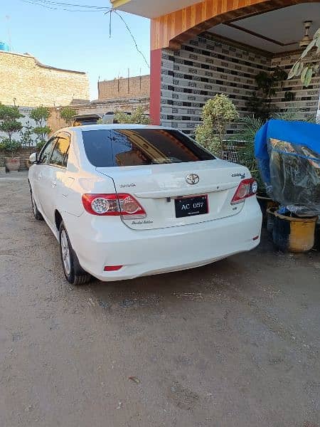 Toyota Corolla GLI 1.6 model 2013 Islamabad Registration white colour. 3