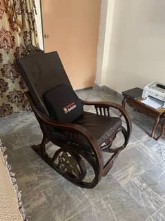 Rocking chair with cushions and back care