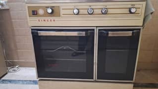 singer cooking range with brass stoves. . . for sale